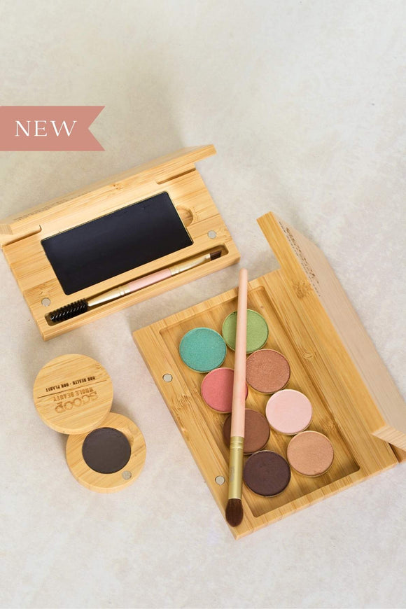 bundle image of three products in the set including brow balm, mascara compact and aurora shade refillable eyeshadow palette - all in bamboo packaging.