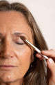 Scoop Whole Beauty model using vegan flat eyeshadow brush to blend in mineral eyeshadow.