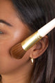 Scoop Whole Beauty model applying natural mineral sun-kissed bronzer with ultra soft vegan angled brush
