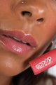 Scoop Whole Beauty model wears natural, non toxic lipgloss - pink pitaya