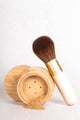 powder foundation with vegan kabuki brush leaning on it - maca - medium - tan 