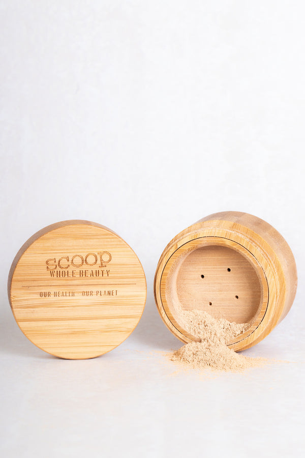 Scoop whole beauty loose pure mineral powder foundation in sustainable bamboo compact. Lightweight and buildable - light 