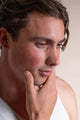 Scoop Whole Beauty male model wears HLA serum displaying its hydrating effect 