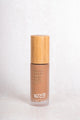 Scoop Whole Beauty light liquid cover foundation with pure minerals and hydrating HLA in sustainable, refillable, glass and bamboo bottle - medium - maca - tan - cocoa