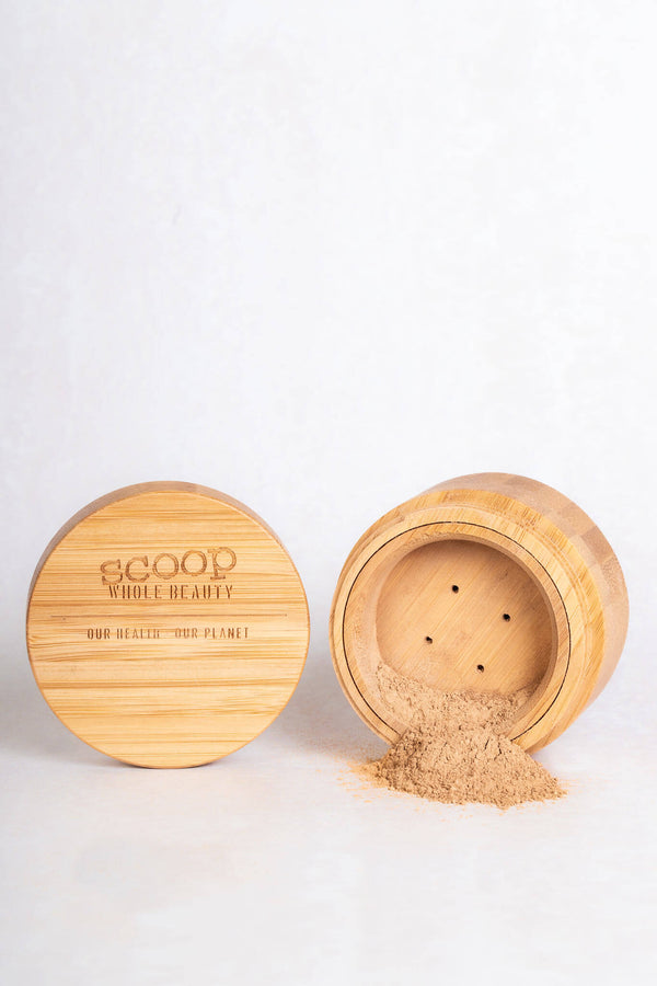 Full-Loop Pure Mineral Powder Foundation with powder coming out of the bamboo container - maca - medium - tan