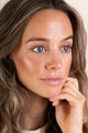 Scoop Whole Beauty model wears sun-kissed natural mineral bronzer
