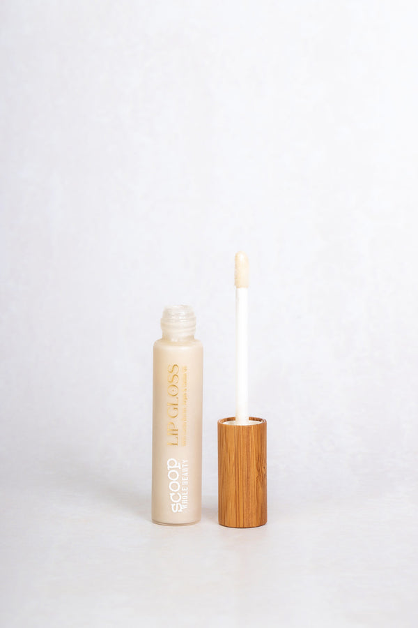 Scoop Whole Beauty natural, non toxic lipgloss in sustainable glass and bamboo packaging in shade clear