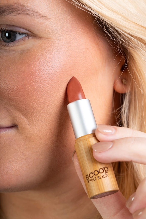 Scoop Whole Beauty model wears natural lipstick as cream blush- peach