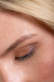 Scoop Whole Beauty model wearing pure earth mineral eyeshadow. Chocolate in crease, terracotta on eyelids - terracotta