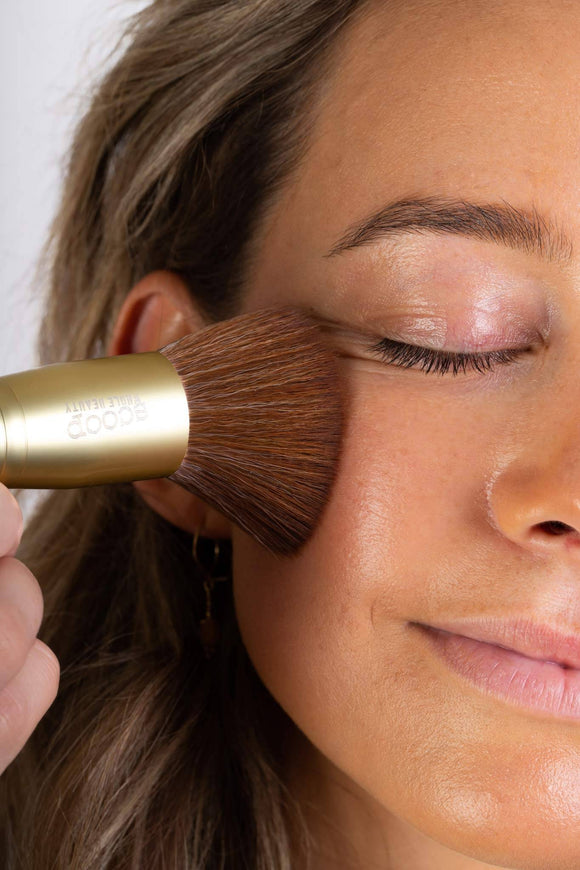 Scoop Whole Beauty model applies natural liquid cover with our ultra soft vegan foundation brush