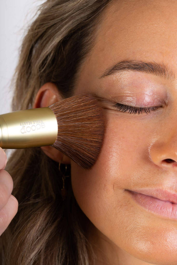 Scoop Whole Beauty model applies natural liquid cover with our ultra soft vegan foundation brush - maca - medium - tan - cocoa