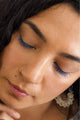 Scoop Whole Beauty model wears the ocean blue mascara shade -a natural, non toxic, mud cake mascara on lashes 