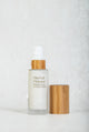 Scoop Whole Beauty natural herbal primer with witch hazel, displayed in refillable, sustainable, glass and bamboo bottle