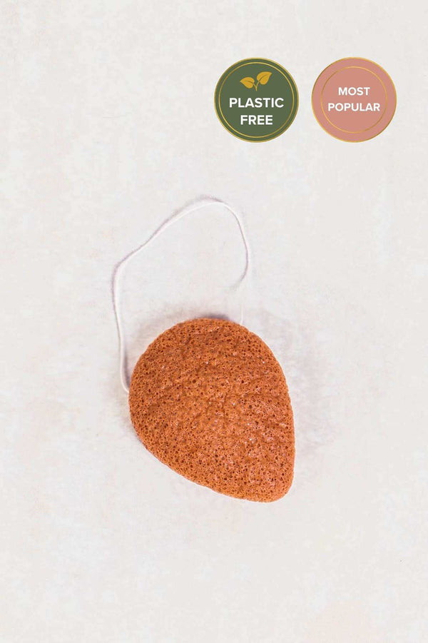 tear shaped pink coloured konjac sponge for use on the face. Small string attached for hanging.