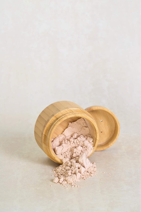 powder spilling from box with sifter behind