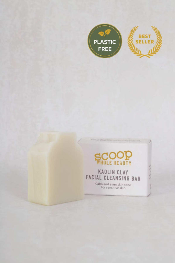small soap bar next to white box