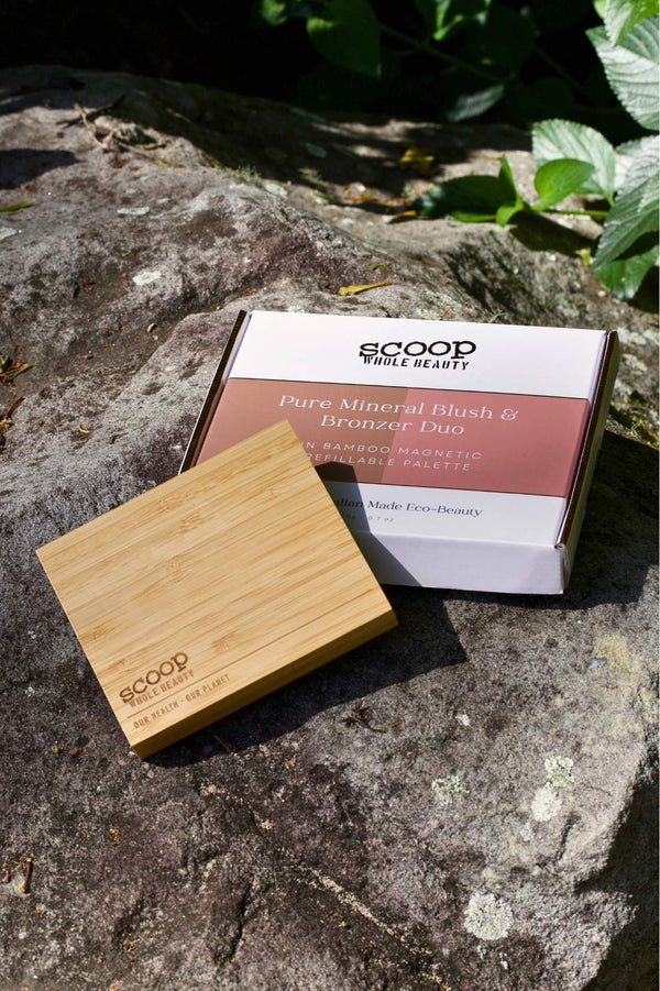 The bamboo palette and box packaging placed on top of the rock.