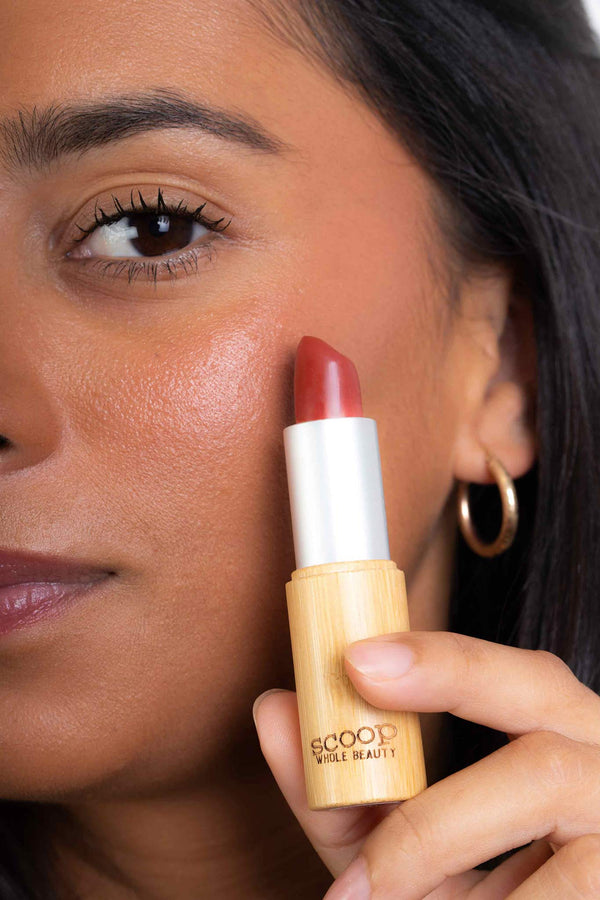 Scoop Whole Beauty model wears natural lipstick as cream blush- cherry